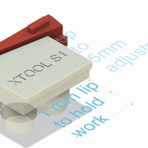 May include: A white plastic clamp with a red lever. The clamp has a 1 mm lip to hold work and up to 5 mm adjustment. The clamp is labeled "XTOOL S1".