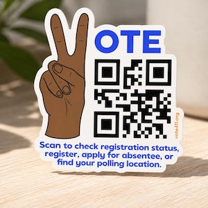 May include: A die-cut sticker featuring a brown hand making a peace sign, the blue text VOTE, a black and white QR code, and the text: Scan to check registration status, register, apply for absentee, or find your polling location. vote411.org is printed.