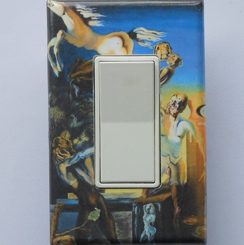 May include: A decorative light switch cover featuring a surrealist painting with figures, a horse, and a blue sky background. The switch itself is white.