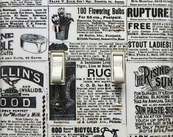 May include: Light switch cover with a vintage newspaper print design. The cover features two switches and text from old advertisements, including "100 Flowering Bulbs" and "Rupture."