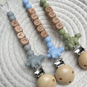 Clip para chupete personalizado, letra de madera, cuenta de dinosaurio, cuentas de silicona, soporte para chupete, cadena para chupete, personalizado, clip para chupete