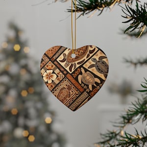 May include: A heart-shaped ceramic ornament with a brown and tan patterned design featuring stylized sea turtles and geometric shapes.