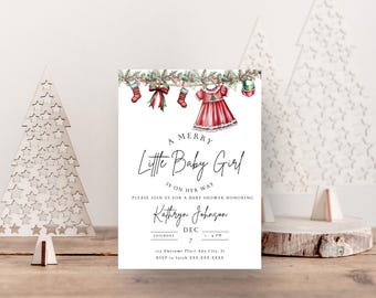 May include: A Christmas-themed baby shower invitation with a red and white dress hanging on a clothesline with stockings and a wreath. The text reads "A Merry Little Baby Girl is on her way. Please join us for a baby shower honouring Kathryn Johnson. Saturday, Dec 7, 3-4 PM. 133 Awesome Place Any City, St. RSVP to Sarah XXX-XXX-XXXX"
