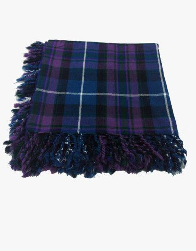 May include: A purple, blue, and white plaid kilt with a fringed edge.