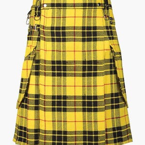 May include: A yellow plaid kilt with black and red accents. The kilt features a pleated design, pockets, and metal hardware. The fabric has a classic tartan pattern, and the kilt is secured with buckles and straps.