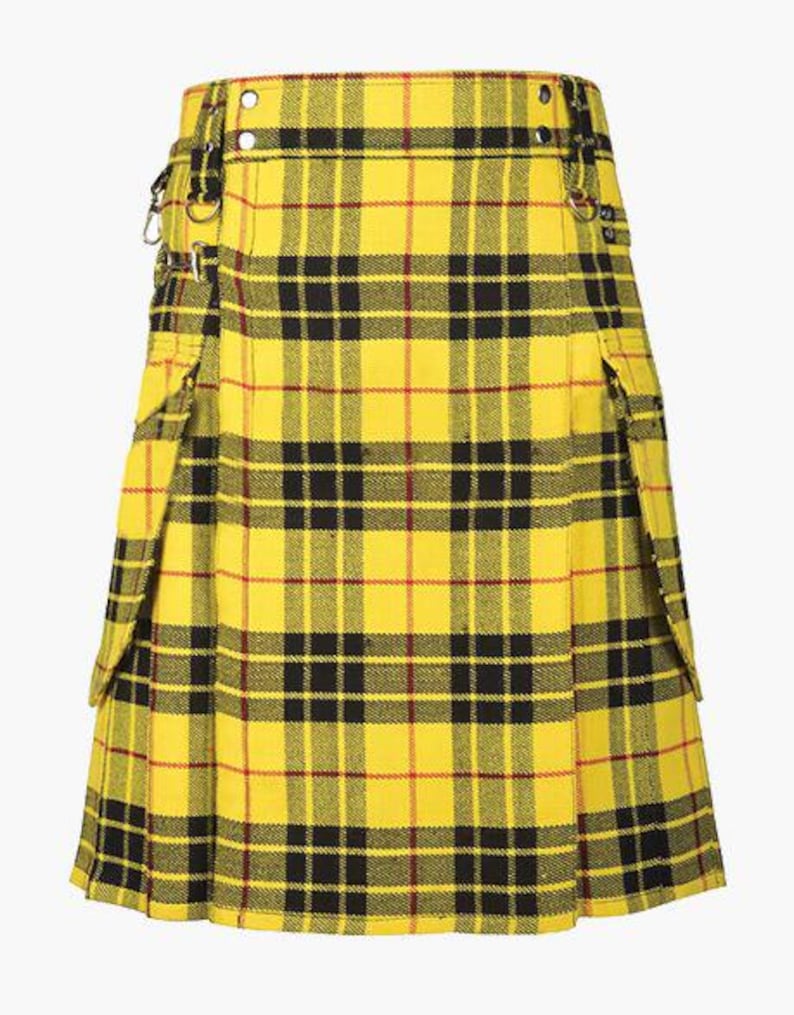 May include: A yellow plaid kilt with black and red accents. The kilt features a pleated design, pockets, and metal hardware. The fabric has a classic tartan pattern, and the kilt is secured with buckles and straps.