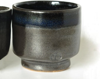 Small 'chawan' tea bowls inspired by Japanese tea bowls with beautiful black glaze and deep blue accents