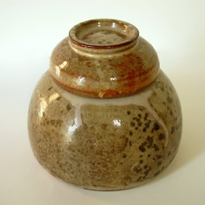 Stoneware jar with small bowl lid and Shino glaze. Honey jar? Herbs? Tea?