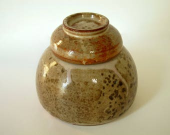 Stoneware jar with small bowl lid and Shino glaze. Honey jar? Herbs? Tea?