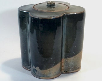 Clover-shaped storage jar with Japanese Shino glaze in smoky golds, grays and blues.