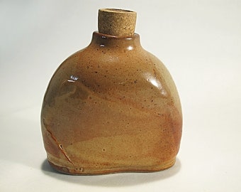 Golden brown stoneware bottle with traditional Japanese glaze