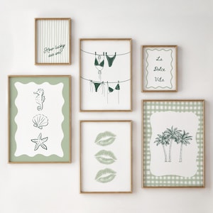 May include: A set of framed art prints with a coastal theme. The prints depict line drawings of a seahorse, seashells, a starfish, swimwear, palm trees, and three sets of lips. One print has the text "How lucky are we?" and another says "La Dolce Vita".