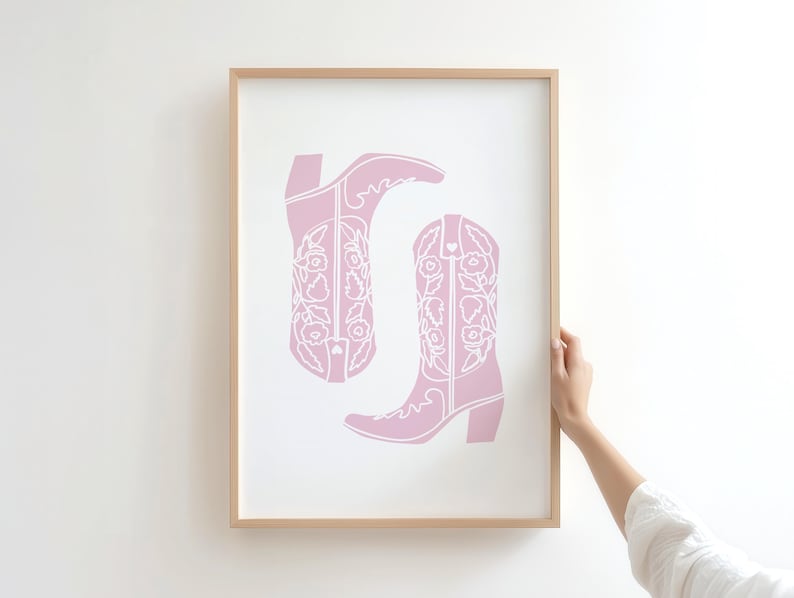 coastal cowgirl decor, pink wall art set, how lucky are we, preppy prints, a gallery wall set of three framed prints in a pink, coastal cowgirl style: one with a bikini on a clothesline, one with the quote 'How lucky are we?' on a striped background, and one with a pair of pink cowboy boots.