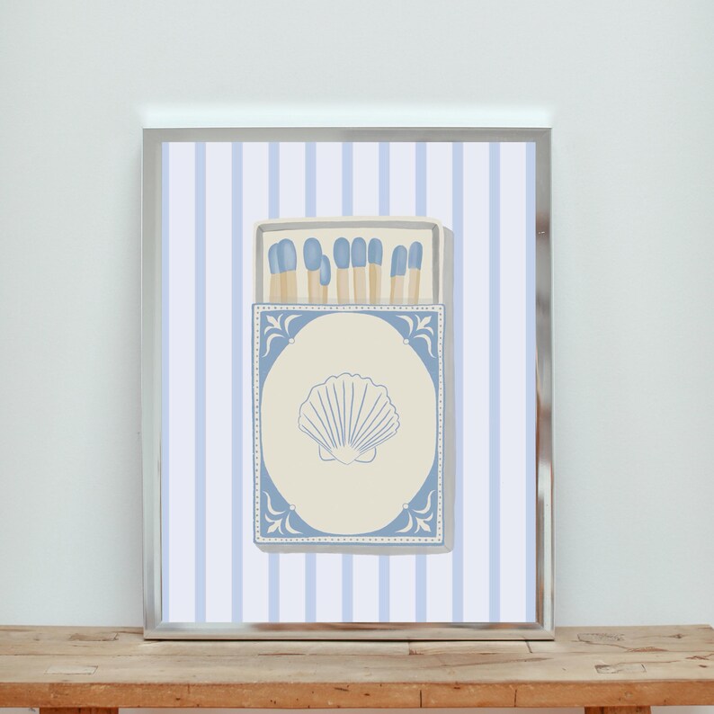 May include: A blue and white striped background with a vintage matchbox illustration. The matchbox has a blue border and a seashell design. The matches inside the box are blue and white.
