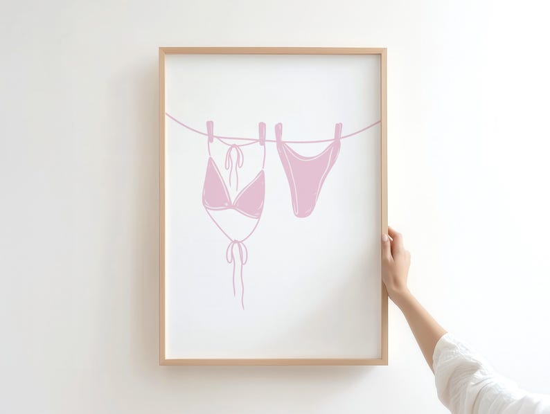 coastal cowgirl decor, pink wall art set, how lucky are we, preppy prints, a gallery wall set of three framed prints in a pink, coastal cowgirl style: one with a bikini on a clothesline, one with the quote 'How lucky are we?' on a striped background, and one with a pair of pink cowboy boots.