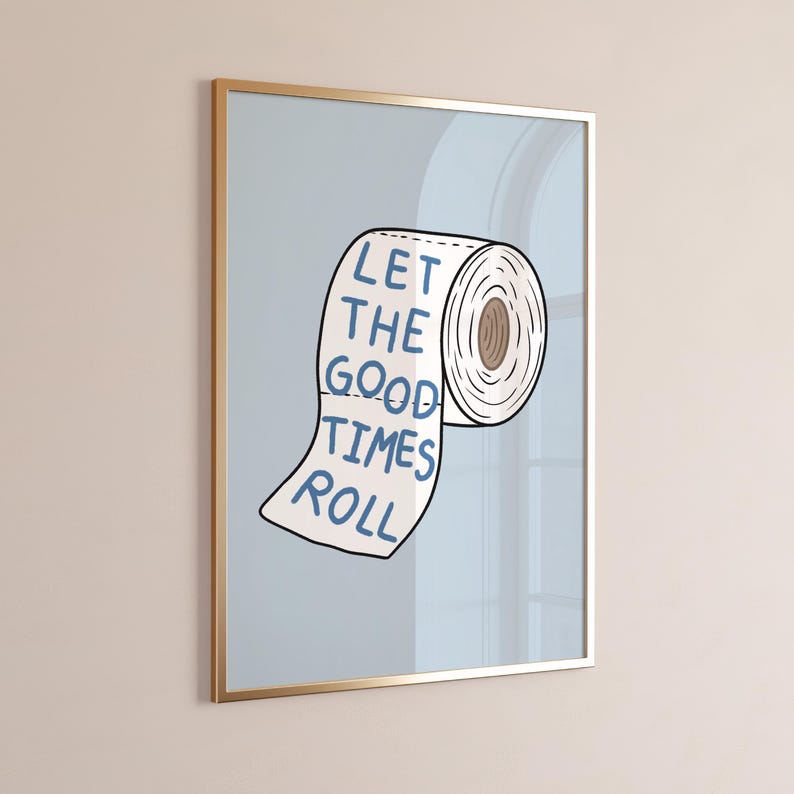Illustrated toilet paper wall art with the phrase “Let the Good Times Roll” in blue lettering on a soft blue background, designed as playful bathroom decor.