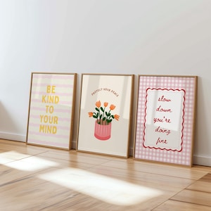 Colorful preppy gallery wall set with motivational quote prints, pastel florals, bows, striped patterns, and playful dopamine decor artwork displayed in gold frames on a neutral wall.