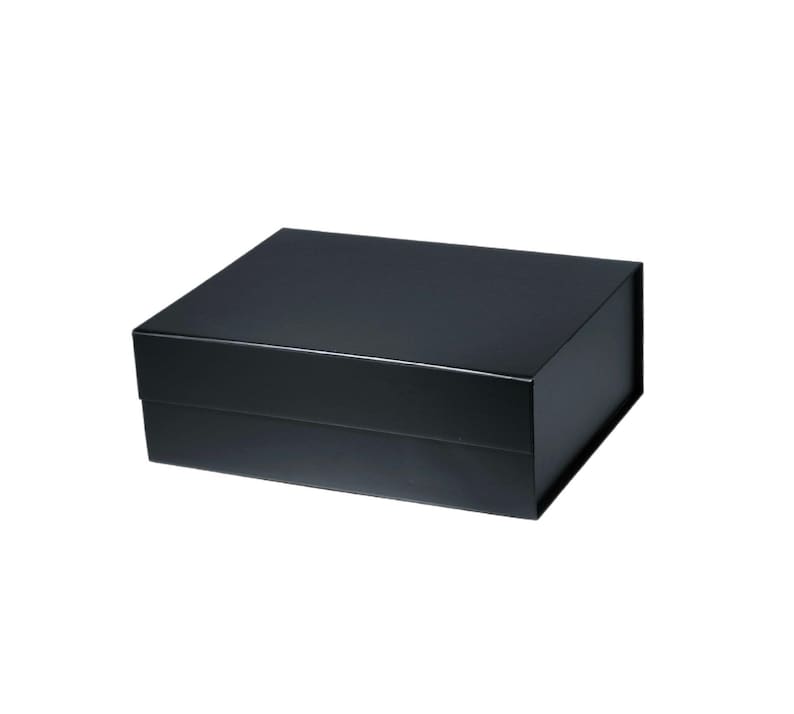 May include: A rectangular black gift box with a matte finish. The box has a lid that fits snugly over the base. The box is set against a white background.