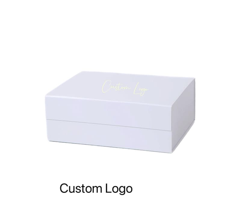May include: A white rectangular box with a lid. The words "Custom Logo" are printed on the top in a light green color. The text "Custom Logo" is printed at the bottom of the box.