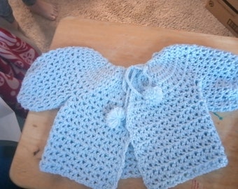 blue crocheted infant sweater