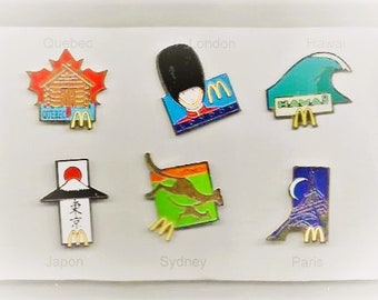 Vintage - Complete set of 11 Mint colorful Enamel McDonald's PINS by  famous French Goldsmith  ARTHUS BERTRAND - years 1990 - with tip clips