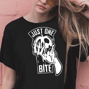 May include: Black t-shirt with a white graphic of a hand holding a poisoned apple with the text "Just One Bite".