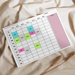 May include: A white printable school timetable with a pink notes section. The timetable is divided into days of the week, hours, and subjects. Subjects include EPS, SVT, MATH, and INFO.