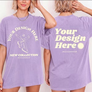 May include: A light purple t-shirt featuring a front graphic with the text YOUR DESIGN HERE, a line-art figure, and NEW COLLECTION. The back displays the text Your Design Here with a sun icon. Both sides include the small text MOCKUP.