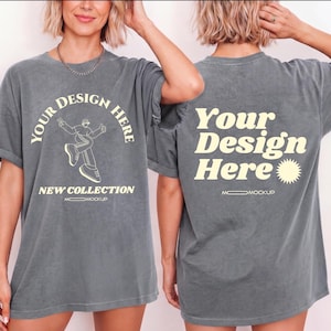 Puede incluir: Una camiseta gris con el texto "Your Design Here" en la parte delantera y trasera. La parte delantera de la camiseta presenta un gráfico de una persona y las palabras "New Collection". La camiseta es una maqueta.