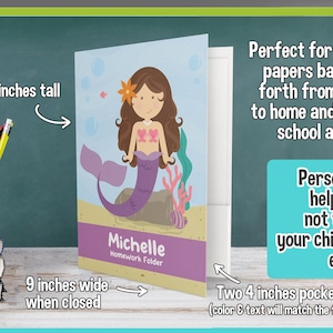 May include: Personalized 2-pocket folder with a mermaid illustration, the name "Michelle" and the text "Homework Folder". The folder is 12 inches tall and 9 inches wide when closed. It has two 4-inch pockets on the inside.