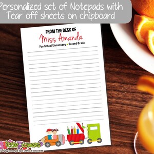 May include: A personalized notepad with tear-off sheets on chipboard. The notepad features the text "FROM THE DESK OF Miss Amanda" and a colorful train illustration at the bottom. The notepad is lined and designed for school use.