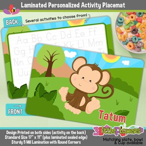 May include: A laminated personalized activity placemat featuring a monkey illustration and the name Tatum. The back side of the placemat has a tracing activity for the alphabet. The placemat is 17 inches by 11 inches and has rounded corners.