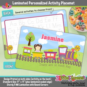May include: A laminated personalized activity placemat featuring a train and a girl with the name Jasmine. The back side of the placemat has a tracing alphabet activity. The placemat is 17 inches by 11 inches and has rounded corners.