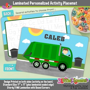 May include: A green garbage truck with a red stripe and a smiling driver. The truck is on a blue background with white clouds. The text "CALEB" is printed in black letters on the placemat. The placemat is designed for children and features a variety of activities on the back.