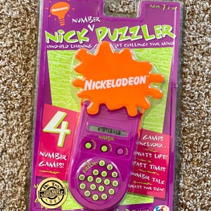 Vintage (1995) Nickelodeon Nick Number Puzzler Hand-Held Electronic Learning Game [Sealed]