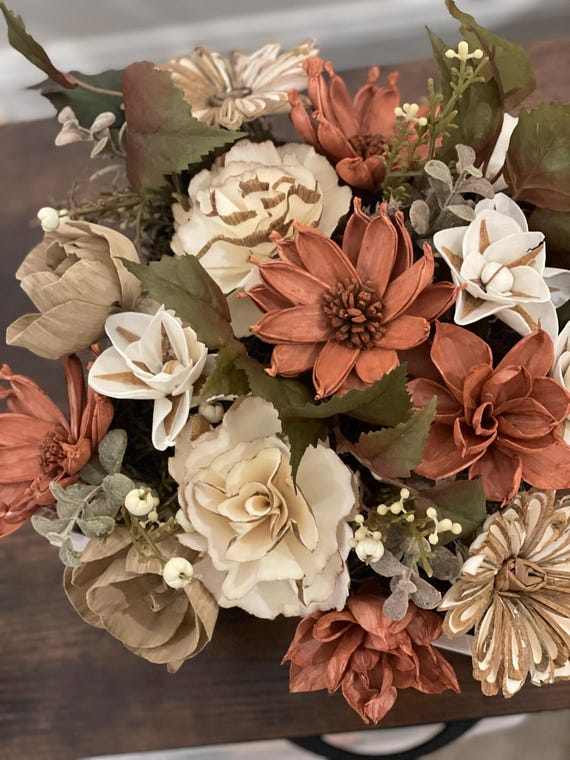Beautiful autumn colored Sola Wood hand dyed flowers arranged in a white box.