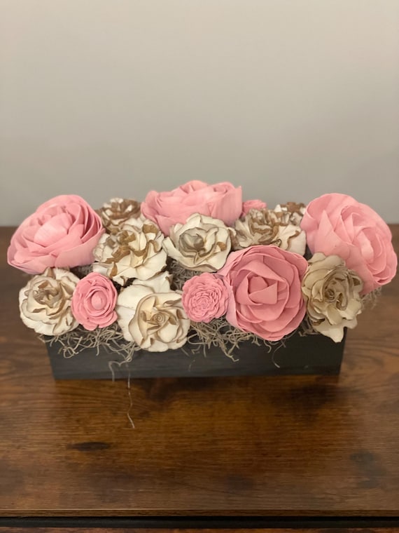 Elegant pink and natural barked Sola wood flowers arranged in a simple black wooden box.