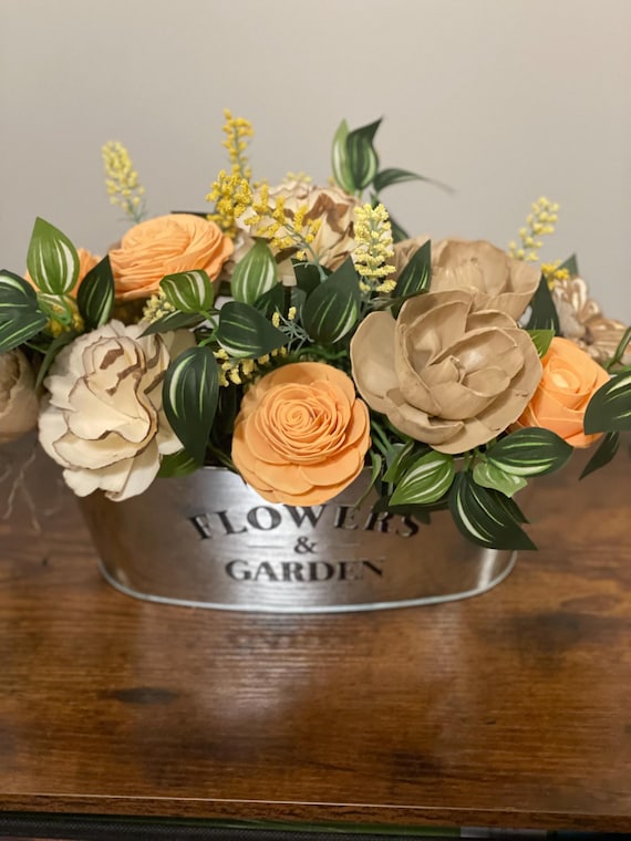 Beautiful fall hand dyed Sola Wood flowers arranged in a charming tin container.
