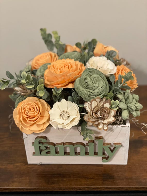 Beautiful hand dyed Sola Wood flowers in peach, sage and natural wood.  Welcome friends to your home with this vibrant arrangement.