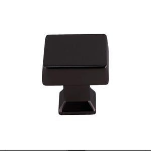 May include: A 29.8mm square cabinet knob in dark pewter finish. The knob has a square base and a slightly rounded top. The text "DH-K94723DP" is visible below the knob.