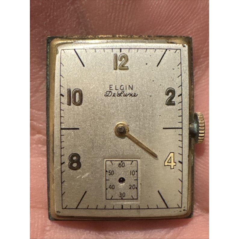 Movimento per orologio da polso vintage Elgin 558 - 17 rubini con quadrante e corona immagine 1