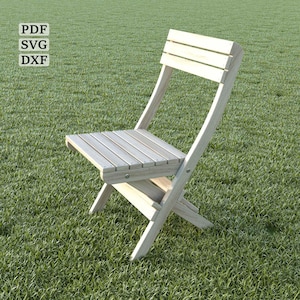 May include: A light wood folding chair with a slatted back and seat. The chair is sitting on a green grassy lawn.
