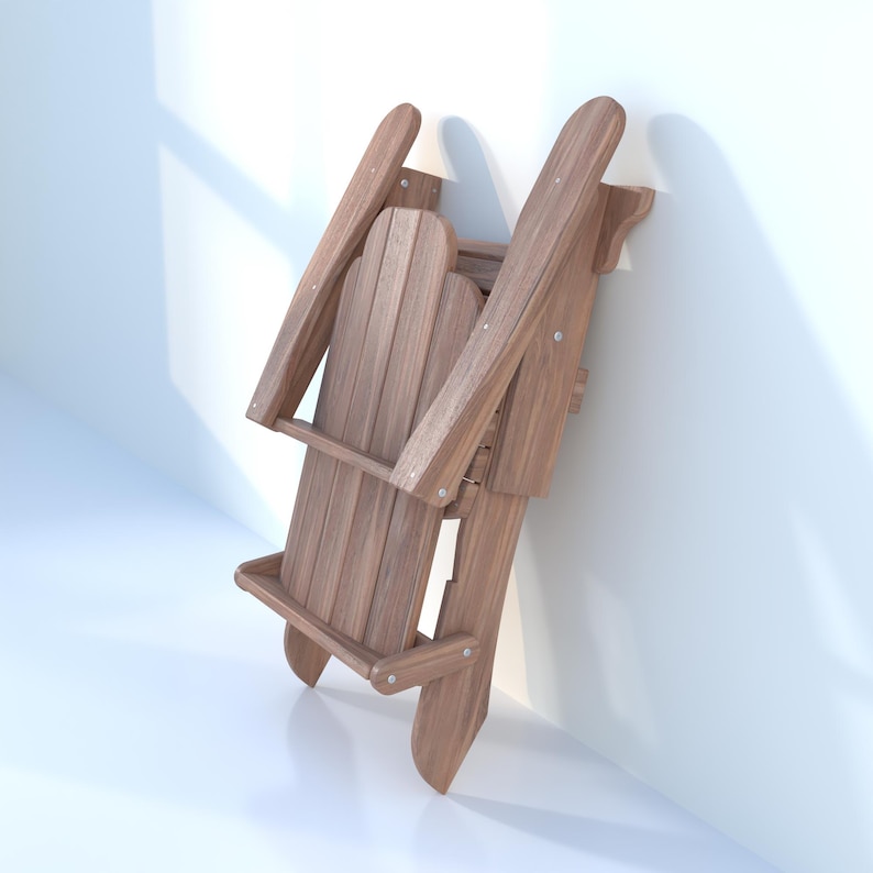 May include: A brown wooden folding chair with a slatted back and seat. The chair is folded and leaning against a white wall.