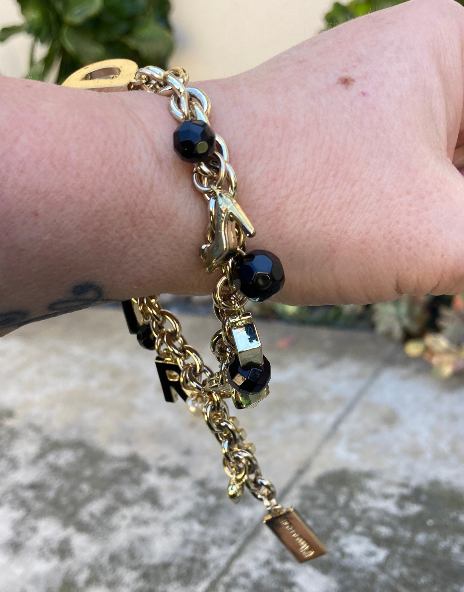 DOLCE AND GABBANA CHARM BRACELET WITH CHARMS GOLD TONE