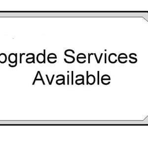 May include: A white octagon-shaped sign with a black border and the text "Upgrade Services Available".