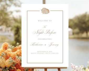 May include: A white welcome sign with a seashell graphic and elegant script. The sign reads "Welcome to The Night Before Celebrating Katherine & Jeremy" with the date and location. It is displayed on a wooden easel.