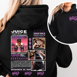 May include: Black hoodie with a graphic print of Juice WRLD, featuring his album cover art, the text "Juice WRLD", "Legends Never Die", "Album 2024", "999", "Best Of", and "December 02 1998". The hoodie also has the text "WRLD" printed on the front in purple.