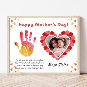 May include: A framed print for Mother's Day with a handprint, a heart-shaped photo surrounded by roses, and the text "Happy Mother's Day!" in red. The print includes a poem and the name "Maya Claire".