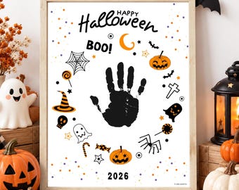 May include: A framed white poster featuring a black handprint in the center, surrounded by orange and black Halloween icons including pumpkins, ghosts, a spider web, a witch hat, and candy. The text reads Happy Halloween, BOO!, and 2026.