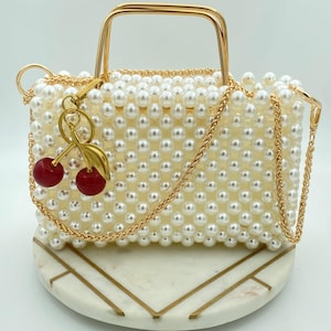 Zia Pearl Purse - Elegante Off-White Perlen Perlen Abendtasche, luxuriöse handgefertigte Hochzeitstasche, perfekt für Bräute und besondere Anlässe.